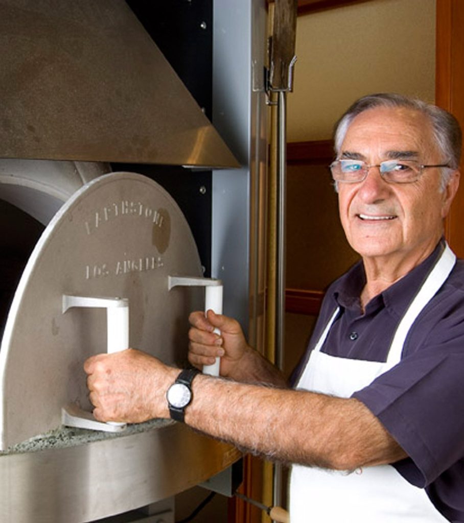 Maurice operating an Earthstone Oven in a professional kitchen setting