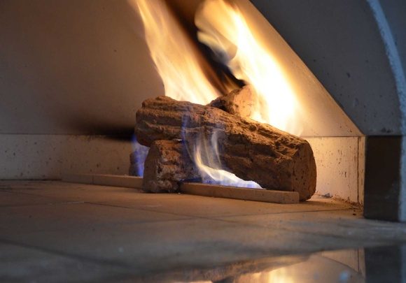 Close-up of wood and flame inside a high-performance Earthstone commercial pizza oven